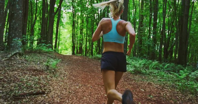 Woman Running in the Forest