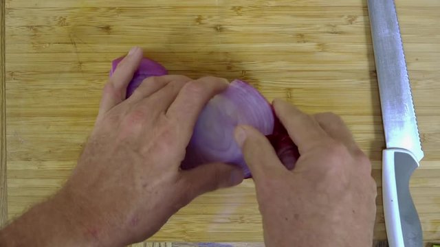 Time lapse overhead view of dicing onions