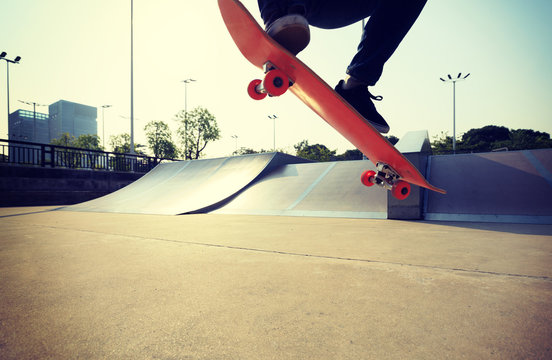 skateboarder legs skateboarding on skatepark