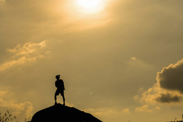 Silhouette of photographer with drone over the mountain, tphotographer and ransportation concept