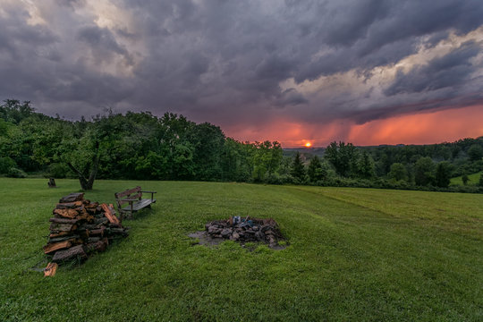 Rain storm at Sunset - Ominous Clouds over Field & Forest