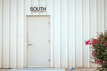 Painted metal door to the south