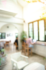 Blurred background made with Vintage Tones,Coffee shop blur background with bokeh and working man in cafe