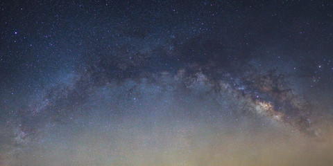 Fototapeta premium Panorama Milky way galaxy bridge as seen from thailand on a clear summer night.