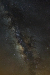 Starry night sky, Milky way galaxy with stars and space dust in the universe, Long exposure photograph, with grain.