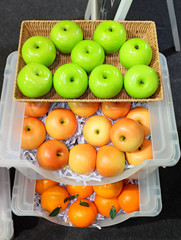 Fresh ripe fruits lying on wooden plate, desk of fruits, concept for healthy eating
