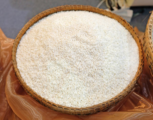 White long rice in small burlap sack.