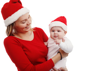 Christmas together-happy mother and girl in Santa hat. In Studio on white background isolated