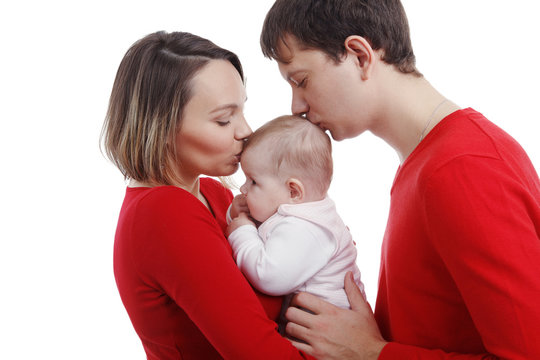 Close up of parents cuddling adorable baby. Image isolated against white background