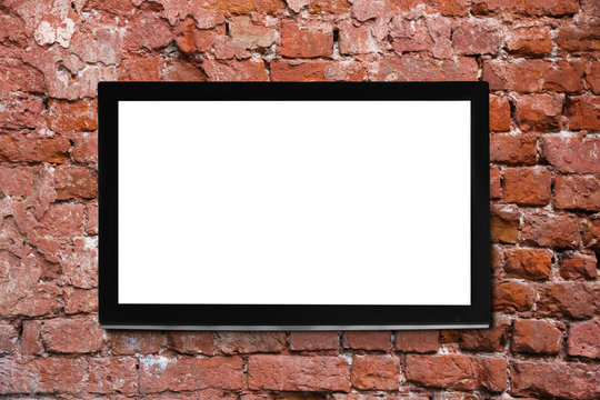Modern TV screen on brick wall background