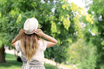 Fototapeta premium Beautiful young woman resting in park