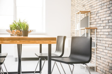 Modern room interior with wooden table