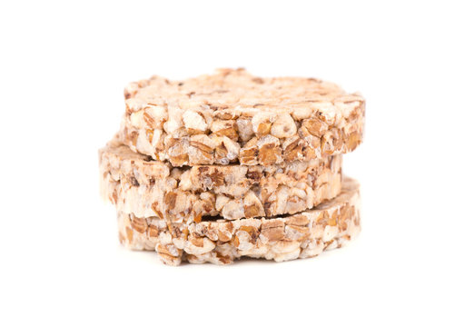 Stack of puffed whole grain crispbread isolated on white background