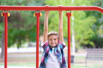Obraz premium Cute boy on playground