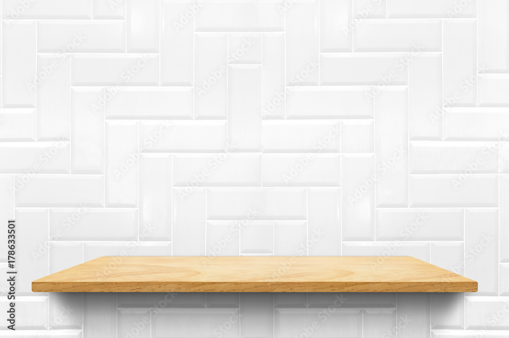Poster empty wood plank shelf at white ceramic tile wall pattern background,mock up for display or montage 
