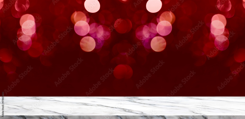 Fototapete empty marble table with sparkling red bokeh lights background,holiday greeting card concept.mock up 