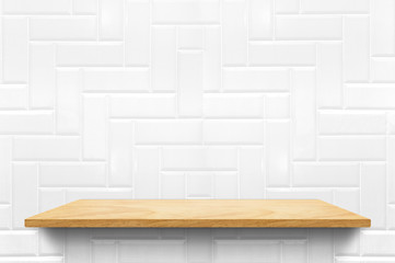 Empty wood plank shelf at white ceramic tile wall pattern background,Mock up for display or montage of product or design.