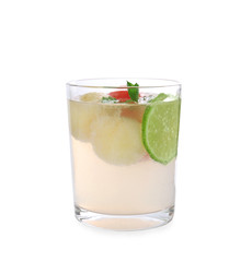 Glass with melon ball drink on white background