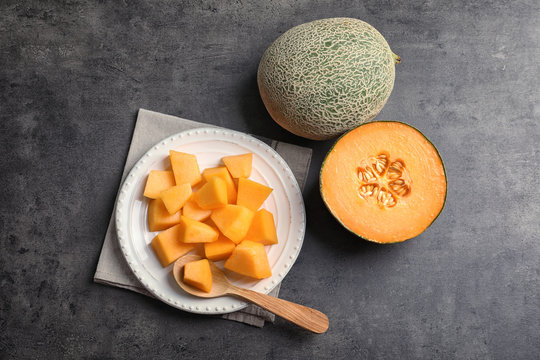 Composition with fresh ripe melon on grey background