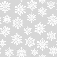 Winter seamless pattern. Snowflakes on a gray background. For your design.