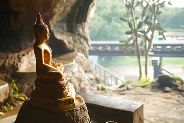 Old buddha statute in the cave. 