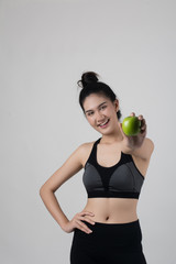 Portrait of attractive smiling woman holding with apple isolated on white background.