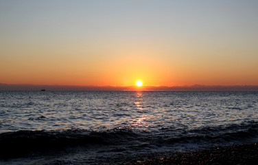 Photo of a bright sea sunset