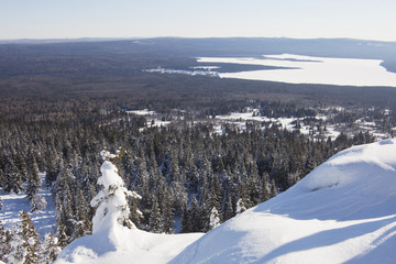 Fototapeta premium View of lake Zuratkul from Mountain range. Winter landscape.