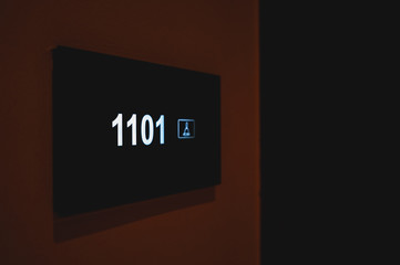A sign with the room number
