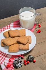 Biscuits, red berries, bumps, gifts, Christmas decor with free space for text. Top view