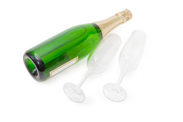 Two empty wine glasses and bottle of sparkling wine