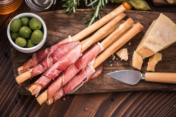 Bread sticks with prosciutto ham,spanish tapa bar food