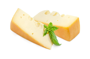 Two pieces of Swiss-type cheese with basil twig
