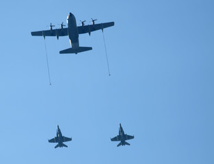 group of planes flying together in refueling operation
