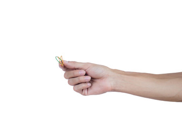 A man hand holding elastic rubber band on white background. Rubber band used to tie the goods. Or...