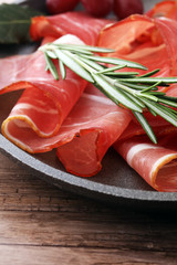 prosciutto with rosemary  or ham of black forest or serrano.
