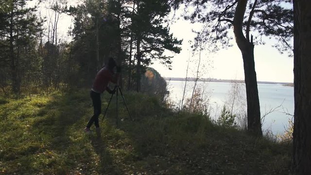 Landscape Photographer with Camera on a Tripod - Female artist taking travel photos in nature.
