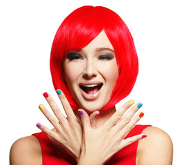 Surprised face of  pretty woman  with  red hair and multicolor nails.