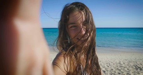 a girl phone to the sea and communicate with friends and relatives thanks to her smartphone, connection concept, connectivity with people in the world of mobile telephony, unlimited internet and call. - Powered by Adobe