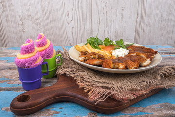 Chicken chop with vegetable and black pepper sauce in plate over wooden table