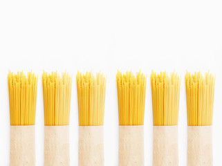 Supermarket. Spaghetti packed into paper on a white background.