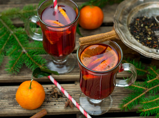 Hot spiced drink from infused tea with rum and mandarin