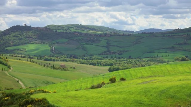 Shadows of clouds slide on the hills of Tuscany, Italy, timelapse 4k
