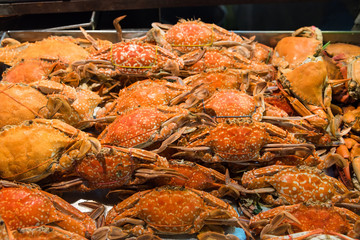 Sea crab on grill is large and very tasty food is available at seafood street market in Huahin of Thailand.