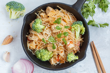 Fried vegan rice noodles with tofu and vegetables