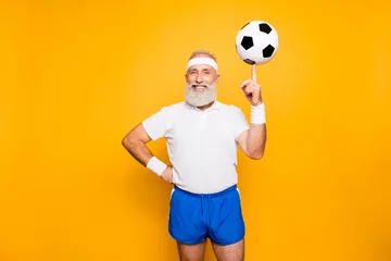 Fototapeten Bodycare, healthcare, weight loss, pride, strength, leadership, motivation, happiness, authority, gym concept. Cool funny modern competetive pensioner, leader, champion plays with ball © deagreez