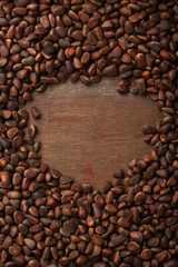 Pine nuts wooden background