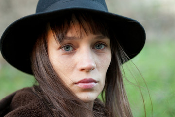 Sad woman with black hat