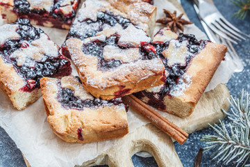 Sweet Christmas berry pie in Christmas decorations