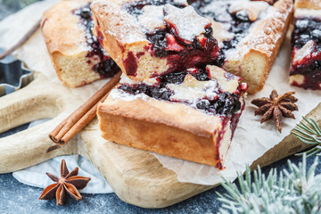 Sweet Christmas berry pie in Christmas decorations